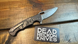 Dead Reckon Knives Ridgeback Modified Black Aluminum Black/ Black Camo Carbon , Dark Stonewash MagnaCut 42